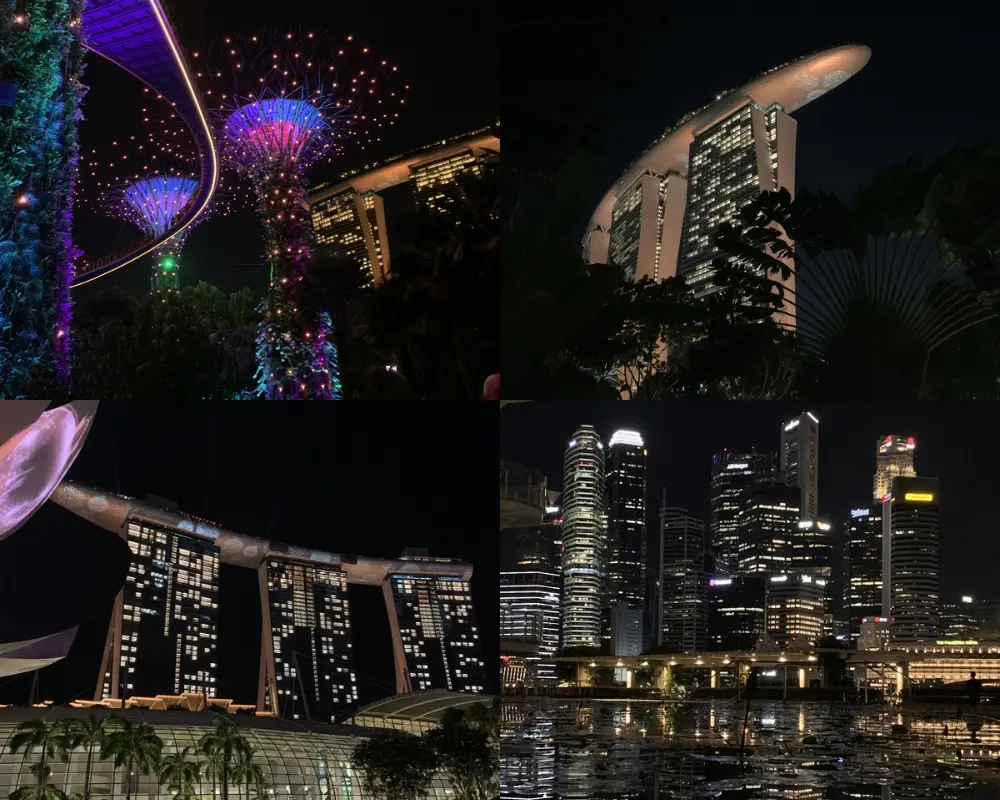 Singapour by night : Supertrees illuminés en couleurs, Marina Bay Sands et skyline du CBD reflétés dans la baie